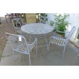 A metal garden table and chairs, 110cm diameter