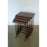 A Quartetto nest of mahogany side table in restored condition, 72cm tall x 56cm x 38cm