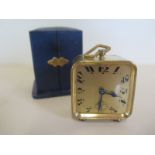 A French travel clock with fitted case, clock approx 7cm high, 6cm wide, winds and adjusts, not