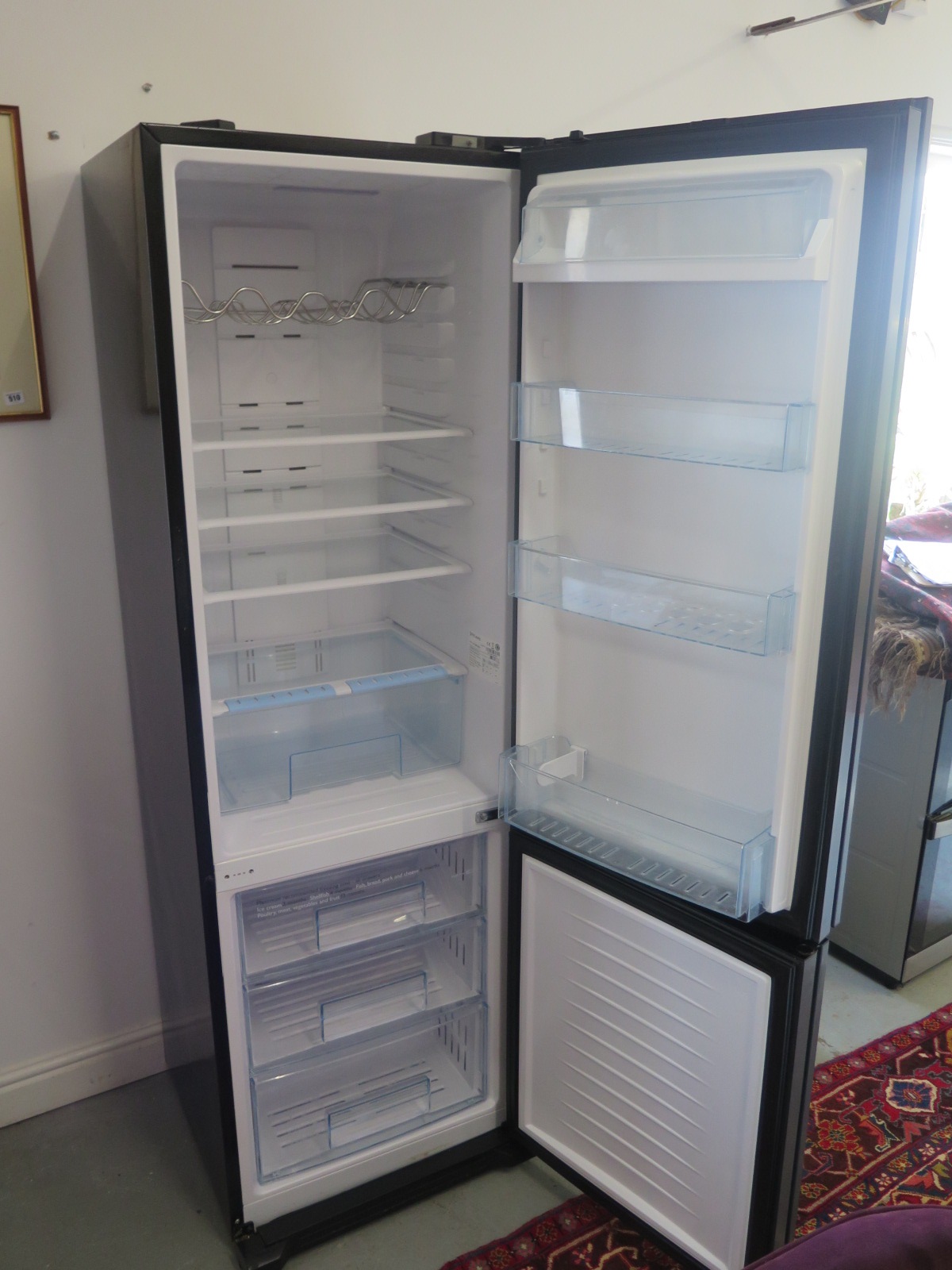 A John Lewis fridge freezer, KE26E580 in working order, some marks to sides, 190cm tall x 59cm wide, - Image 2 of 3