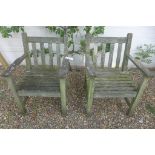 A pair of teak garden armchairs, by Barlow Tyrie Ltd