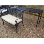 A lazy Susan metal bench and a side table