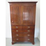 A 19th century mahogany linen press with three internal slides above four drawers, on bracket