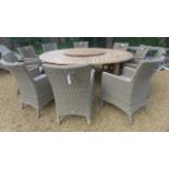 A Bramblecrest 220cm round teak table with Lazy Susan, ten Oakridge armchairs with cushions and