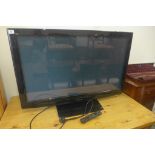 A Toshiba Viera flat screen TV with a 42 inch screen, with remote control, in working order, model