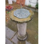 A sundial on a concrete base