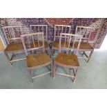 A set of six 19th century elm seated kitchen chairs, three have cracks to seats, general wear to all