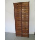 A pair of good oak filing drawers by Amberg circa 1929 each with 15 drawers with internal paper