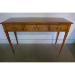 A birch three drawer hall table on square tapering legs, 76cm tall x 125cm x 42cm - made by a