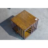 A small table top revolving oak book case, 28cm tall x 29cm x 29cm