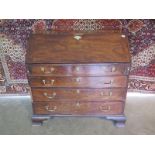 A Georgian mahogany four drawer bureau, 107cm tall x 113cm W x 57cm with good colour, needs some