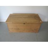 A 19th century pine blanket chest with an internal candle holder, 111cm W x 50cm H x 55cm D