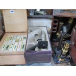 Three cased Victorian microscopes, two are all brass, one is nickel silver on brass, together with