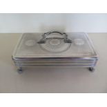 A Dutch silver trinket box standing on claw feet with dolphin handle some small dents and wear - 4cm