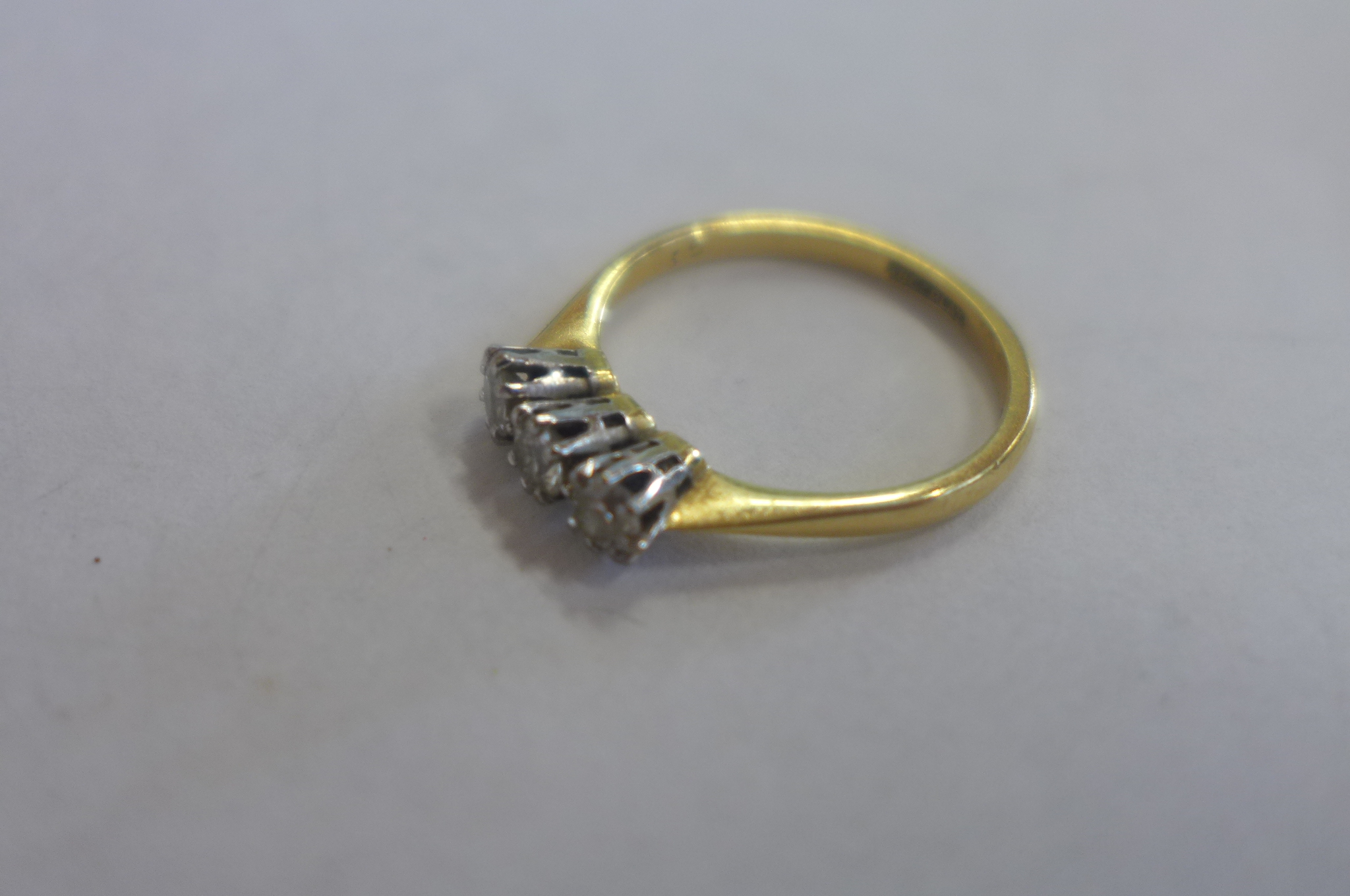 An 18ct gold and platinum three stone diamond ring, size L, approx 2.3 grams - Image 3 of 4