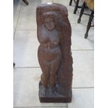 A carved wooden sculpture of a naked female figure by Cyril Saunders Spackman 1887-1963, signed with