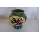 A small Moorcroft vase, in good condition, small flaw to rim