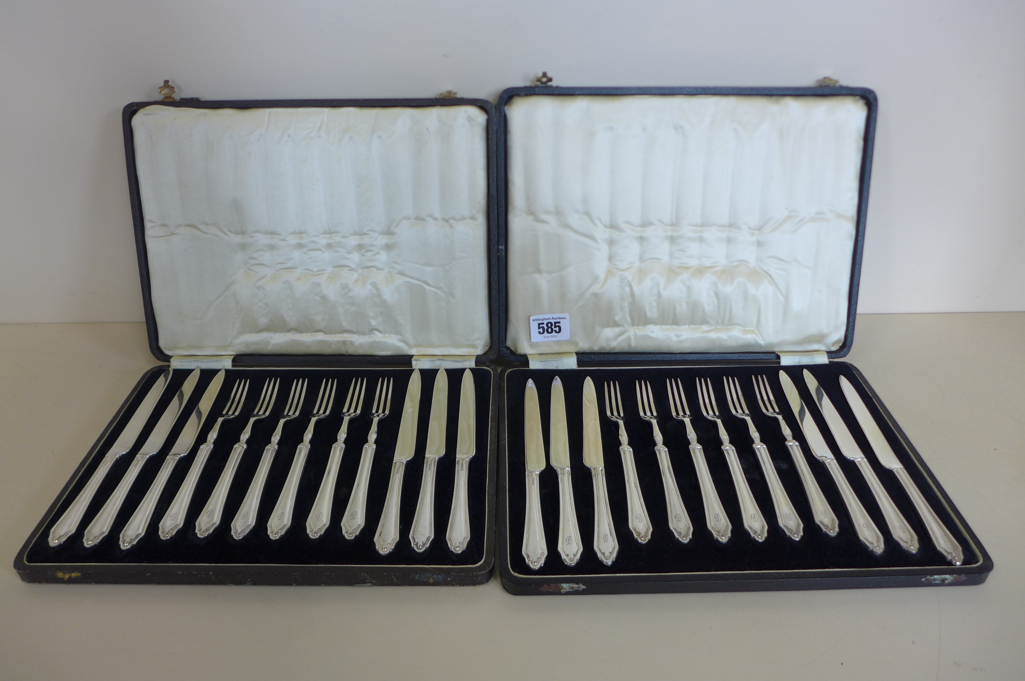Twelve pairs of plated fruit knives and forks, with reeded decoration and stepped terminals,