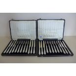 Twelve pairs of plated fruit knives and forks, with reeded decoration and stepped terminals,