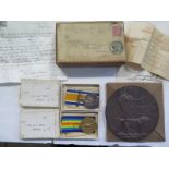 Two WWI medals to Pte BJ Coles, Bedf.R 32215 with Death Plaque and birth certificate, dated 27th