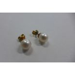 A pair of 18ct yellow gold pearl earrings, pearls approx 7mm wide