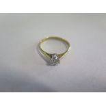 An 18ct yellow gold diamond solitaire ring, approx 0.20ct, size M/N, approx 1.6 grams, some minor