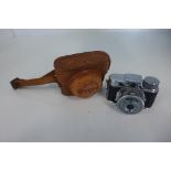 A Mycro miniature camera with leather case, shutter working, good condition