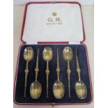 A set of six silver gilt anointing spoons in original presentation box, approx 2 troy oz, in good