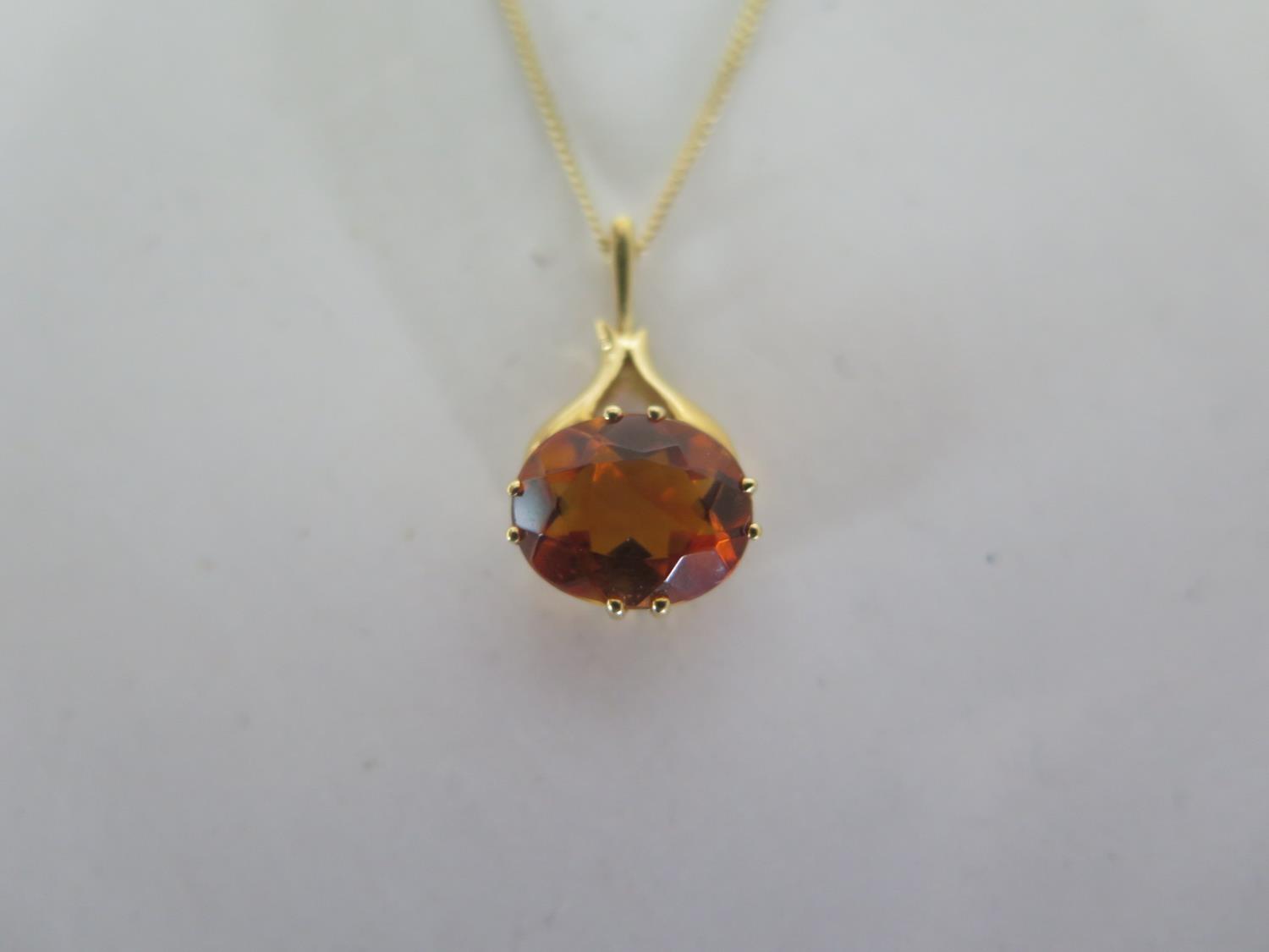 An 18ct yellow gold topaz pendant on an 18ct yellow gold 45cm chain, stone approx 9x7mm, in good - Image 2 of 3