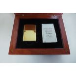 An 18ct yellow gold limited edition Zippo lighter, no 4 of 50, with presentation box, in good