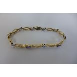 A 14ct tanzanite and diamond set bracelet, approx 18cm long, approx 8.3 grams, in good condition