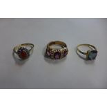 Two 9ct gold dress rings and a 9ct gold and silver dress ring, overall approx 8.7 grams overall, two