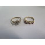 Two 9ct yellow gold rings, both size G, one set with two small diamonds, total weight approx 3 grams