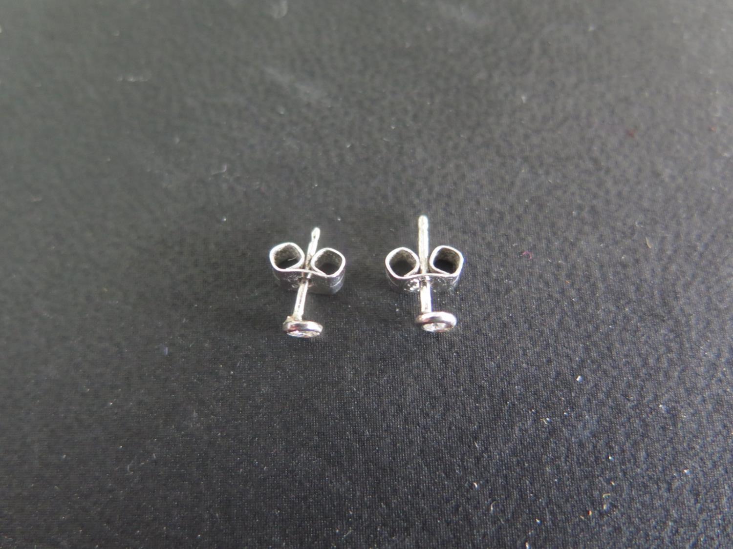 A pair of 9ct gold diamond stud earrings - Image 2 of 2