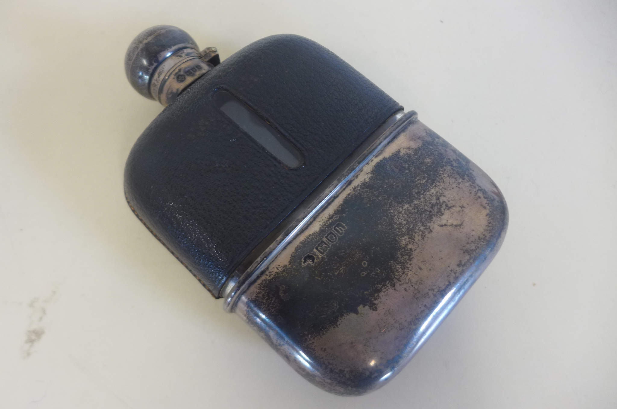 A hip flask with silver top and cup - 14cm tall, in generally good condition, some wear