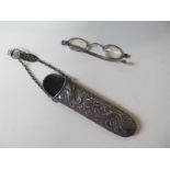 A Chinese silver spectacle holder with dragon design and a pair of silver part glasses, total weight
