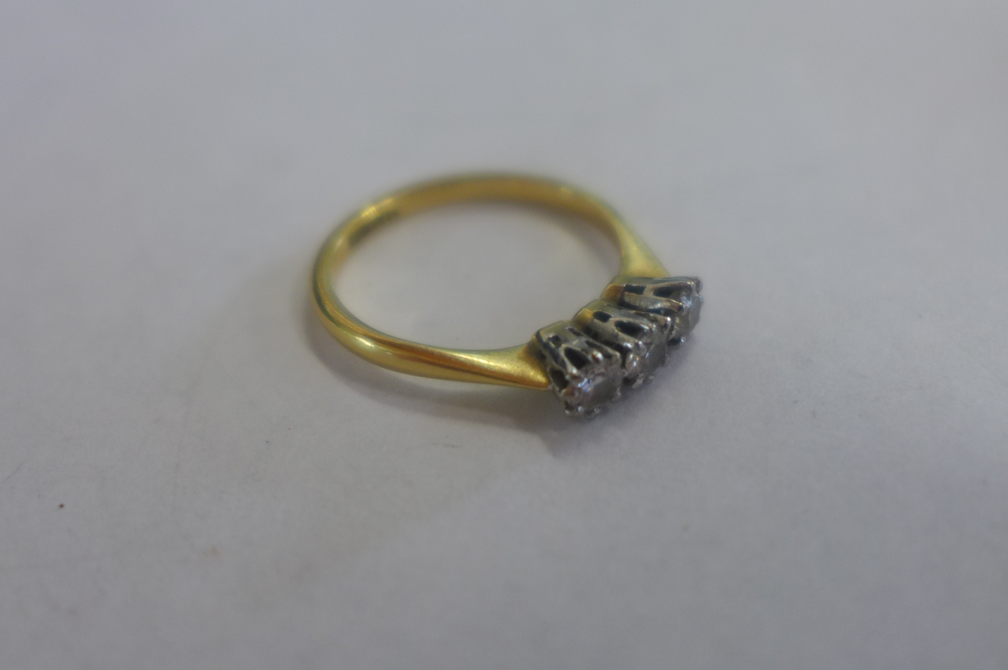 An 18ct gold and platinum three stone diamond ring, size L, approx 2.3 grams - Image 2 of 4