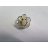 A 9ct yellow gold opal seven stone ring, size N, approx 4.5 grams, in good condition