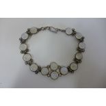 A silver bracelet set with cabouchon moonstones, approx 20cm approx 10.9 grams, in good condition,