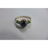 A 9ct gold sapphire and emerald ring, size Q, approx 2.4 grams