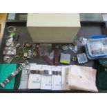 A collection of Rolex and other paperwork, straps, buckles and an outer box