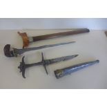 A kris with scabbard, blade length 31cm and an Eastern dagger with scabbard, 29cm long, please see