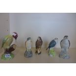 Three Beswick bird whisky decanters, a Beswick Woodpecker figure and a Doulton decanter, all empty