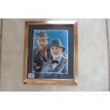 A framed 8x10 inch Indiana Jones photo signed by Sean Connery and Harrison Ford with COA
