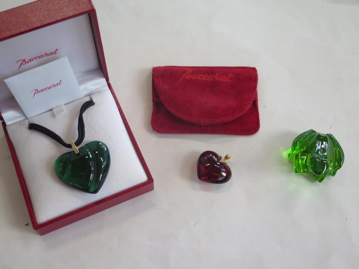 Two Baccarat crystal heart shaped pendants, one with 18ct gold mount together with a Baccarat