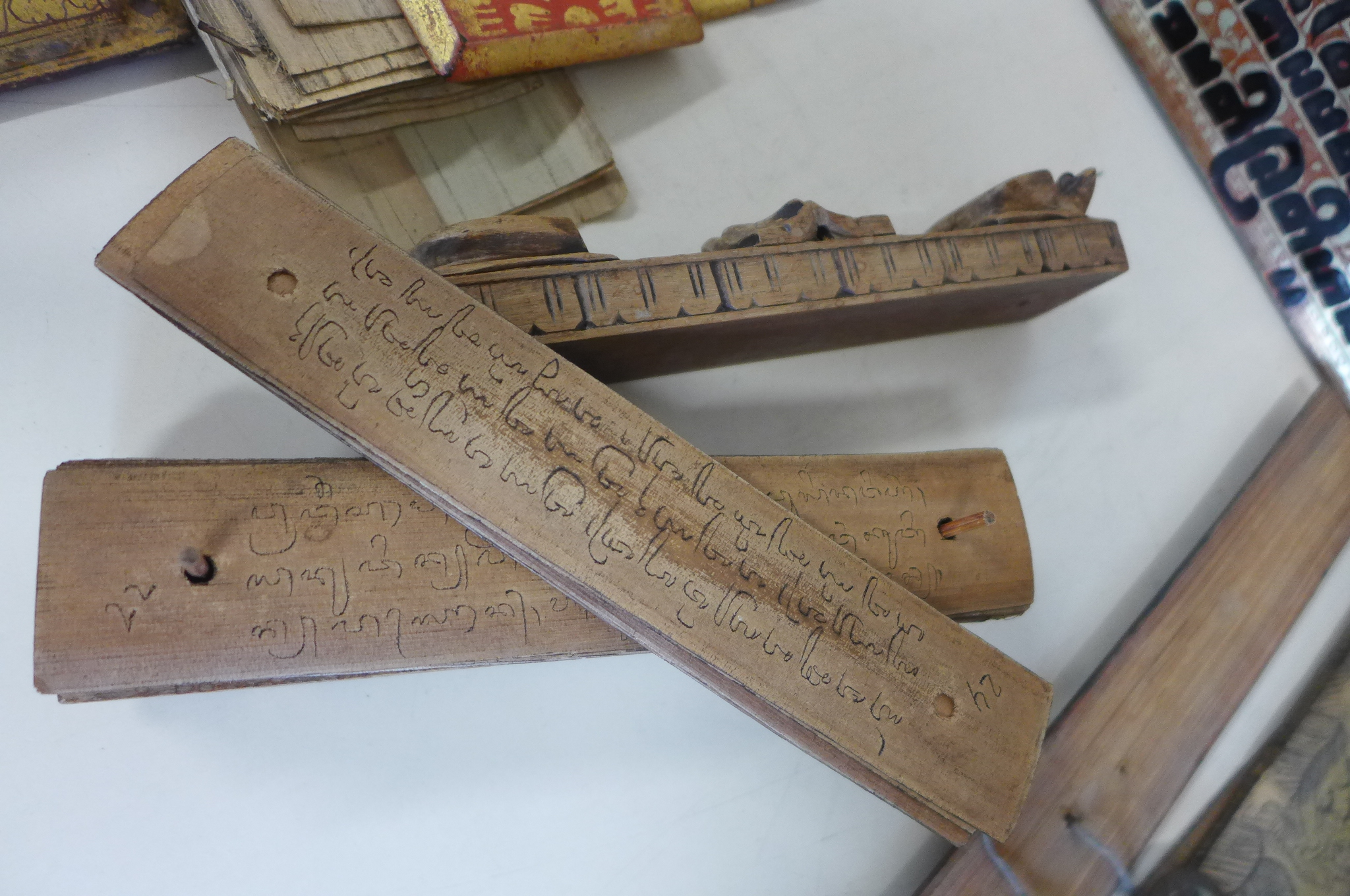 A collection of Tibetan prayer scripts, including a carved block - 15cm long - Image 2 of 6