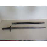 A carved bayonet short sword marked PDL, blade length 58cm, general pitting and wear but blade