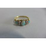 A yellow gold opal and diamond ring, tests to approx 18ct, ring size N, approx 3.2 grams, opals