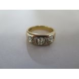 An early to mid 20th century 18ct gold diamond three stone ring, the old-cut diamonds inset to the
