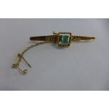 An 18ct yellow gold brooch set with a single emerald, approx 0.50ct total weight approx 7 grams,